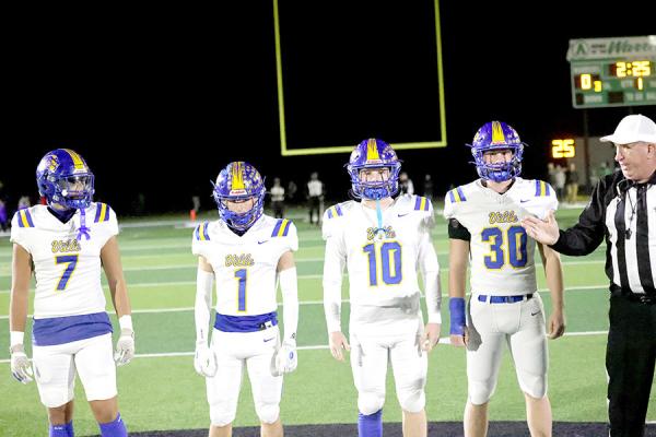 The Referee gave pre-game instructions to four of Holdenville’s All-District Players prior to a Wolverine State Play-off Game. # 7 Brett Bruner was selected as an All-District Defensive Lineman, # 1 Cash Lining was selected as an All-District Defensive Back, # 10 Camron Swayze was selected as an All-District Inside Linebacker, and # 30, Bo Black was selected as All-District Linebacker of the Year.