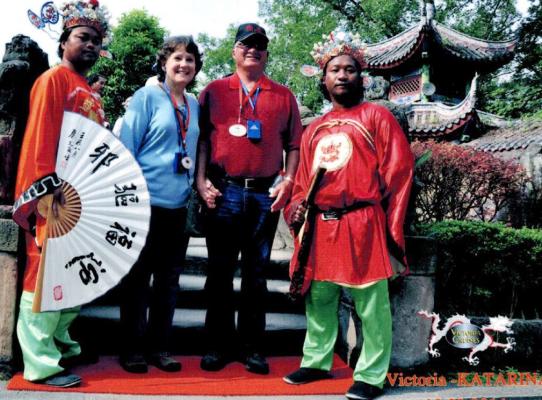GLOBE TROTTERS - Roy and Mary Boydstun are pictured with some of the locals in China during one of their many trips abroad. The couple enjoys seeing the world and their travels have taken them to six of the seven continents. They hope to visit the seventh, Antartica, in the near future. (Courtesy photo)