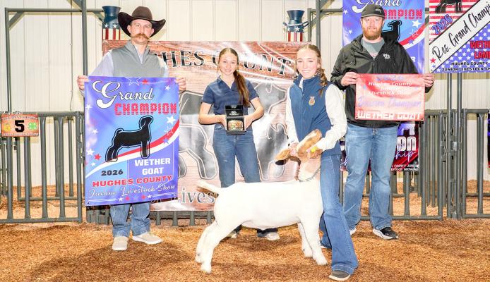 MOSS STUDENT TIMBER POWELL - Shows off her Grand Champion Wether Goat at the Hughes County Livestock Show.