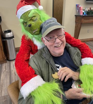 NO STRANGER TO BANKS! The Grinch will have to work harder than that to steal Pastor David Pope’s Christmas spirit. Pastor David, now pastor of the Penn West Baptist Church, is known by most everyone in the community as the former President of the Bank N.A.
