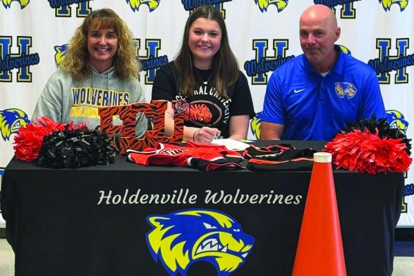 TRISTIN GOODMAN WILL BE AN ECU CHEERLEADER! Tristin has signed with the East Central Tigers. Holdenville High School Principal Shawn Richmond and Athletic Director Darin Johnson were on hand as Tristin signed with the Tigers