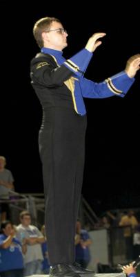LEADER OF THE BAND......Holdenville Drum Major Landon Sipes. directors the GoldenPride band at halftime of the Wolverines game at Community Christian. The Golden Prides performance was their first in full uniform.