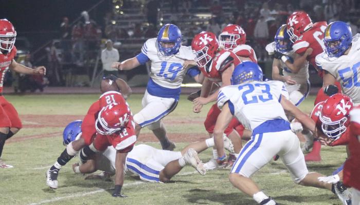 The Holdenville defense swarmed around this Kingston ball carrier. Christian Zambrano had the ball carrier by the ankle while # 23 Tatum Sanford, # 19 Clinton Roland, # 50 Julius Jackson and # 9 Cash Carter rush in to help.