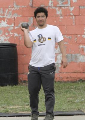 Holdenville shot putter, Julius Jackson, prepares to take his turn at the meet in Konawa. The track team will travel to Madill on Saturday to compete in the regional track meet.