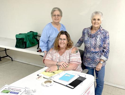 Ward 4 precinct workers pictured above on Primary election day are (seated) Nicole Cellars, (standing) Loita Sharp and Donna Lipe.