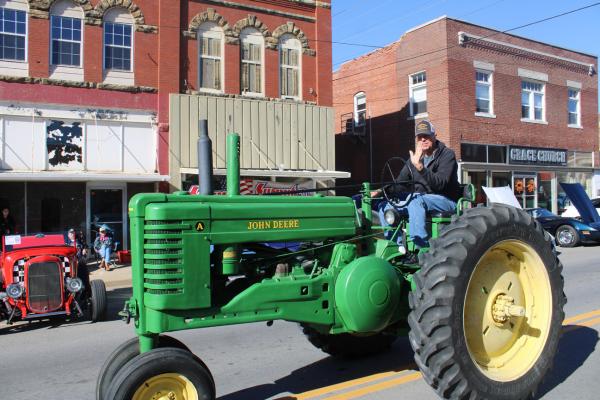 Denny Langdon seen riding part of his grandchildren’s inheritance down Main Street.