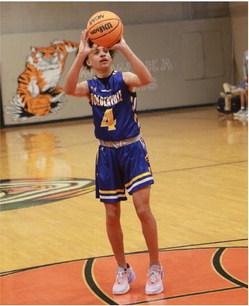Holdenville’s Kase Sipes takes aim before sinking a three point shot at Wewoka. The Wolverines dominated the Tigers in a 92-32 win over Wewoka.