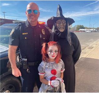 Police Chief Kyle Lening with Terri Shaw and Raylee Lawson.