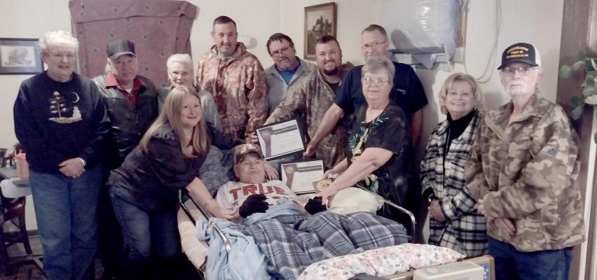 DANA SIMPSON, COORDINATOR FOR TRADITIONS HOSPICE PRESENTED RAY IN A PINNING CEREMONY on Friday, January 6, 2023. He was presented with the certificate for his service with the National Guard and a certificate for his service with the Army. Also presented to him was a plaque for all his years of service, along with a pin of the American Flag. Pictured are: Donna Holliman, Gene Brittain, Susie Brittain, Larry Carter, Josh Moyer, David Chaffin, Vickey Jones, Susie Ross and Jeff Hinze. (Photo by Karen Evans)