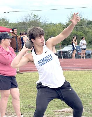 Tank Redmond prepares to launch the shot put in the track meet at Prague.