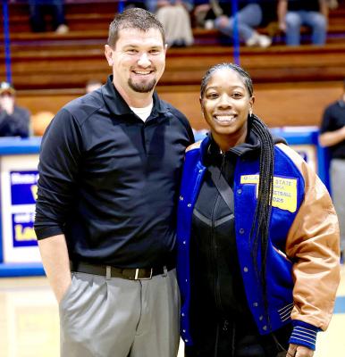 Holdenville Head Coach.Dillion Snow, paused for a picture after presenting Myah Olden with her All-State Jacket. Olden was honored after earning a spot on the All-State team.