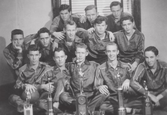 THE GREATEST HOLDENVILLE HIGH SCHOOL BASKETBALL TEAM EVER...The 1942 undefeated State Champions pictured above are: FRONT (L-R): Everett McGhee, Hoyt Ferguson, A.L. Bennett, Pete Kirkpatrick, and Aubrey (Spider) Vannoy; SECOND ROW: Elmo McGhee, Frank Evans, Owen Bennett, Leon Stone, and Bobby Vannoy; BACK: Billy Dale Smith, Coach John Daugherty, and Frank Crane.
