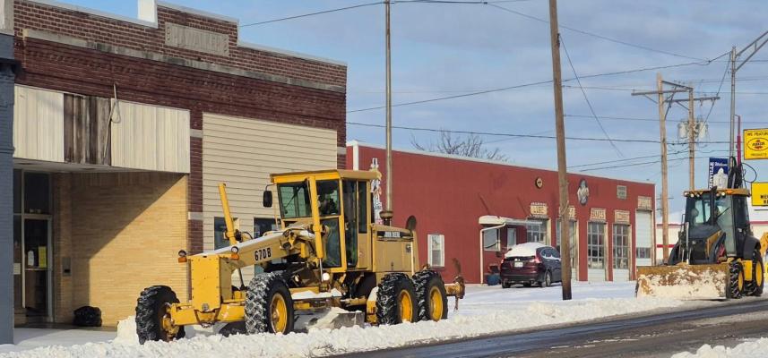 Holdenville Street Department clears parking for Main Street businesses.
