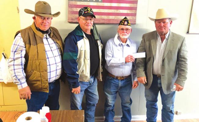 Shown accepting to donation to the American Legion are (left to right) Vice President Vinson, Legion members Jerry Young and Jeff Hinze, and President Barrett.