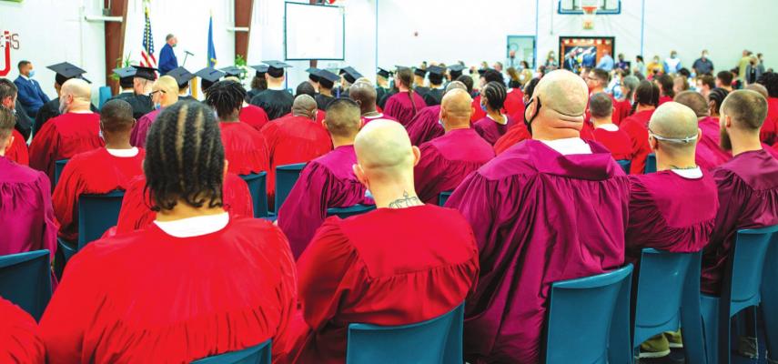 The Davis Correctional Class of 2021 listens to the opening remarks of Master of Ceremonies, Principal R.W. Grant.