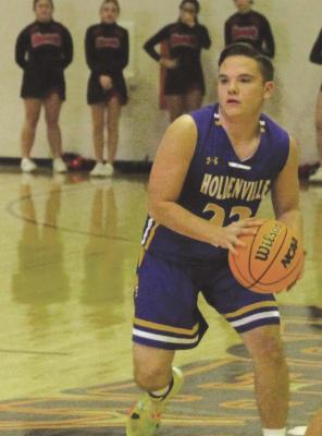 Holdenville’s David Olney drives to the basket in the Wolverines’ contest with North Rock Creek. Holdenville will travel to Stroud this week for the 66 Conference Tournament.
