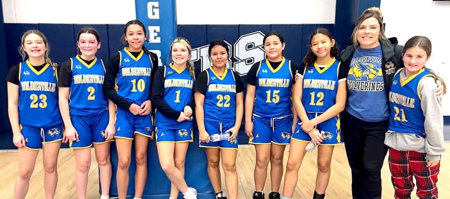 COACH LESLIE PHILLIPS-CARTE’S 7&amp;8 GRADE GIRL’S BASKETBALL TEAM HAS WON 12 GAMES THIS SEASON. The girls paused from their winning ways to pose for a team picture. Team members are: L to R: Payleigh Enos, Lucca Smith, Harlow Evans, Abigail Taylor, Myhakv Larney, Mekv Larney, Maleah Bennet, Asst. coach Marissa Shaffer, and Brinley Kespiller.