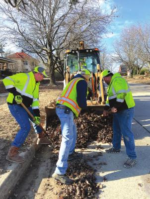 Street Commissioner Jim Thetford along with Street Department employees Larry Foster and John Houlton working hard to keep our city streets looks good.
