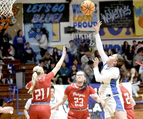 Holdenville’s Virginia Piza let a shot fly in the Wolverines’ game with Prague. Piza scored 17 points in the contest.