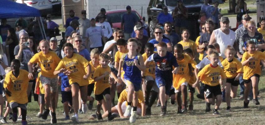 BOSTON BOWMAN LEADS THE PACK out of the gate at the Cross Country Meet hosted by Holdenville Schools at Holdenville Lake this past Saturday. Boston was one of several under kids from nearly 20 different schools to compete.
