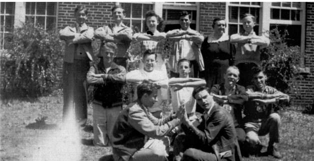 PICTURED ABOVE IS HOLDENVILLE HIGH SCHOOL’S SOLID GEOMATRY AND TRIG CLASS AND ALSO THE AERIAL MATHMATICS. Back Row: Robert Dalton, George Cotton, Sunny Hopkins, Billy Dale Smith, Mrs. Foote, and Ralph Buchannon. Middle Row: Vernon Friend, Howard Thomason, Glen Thomas, Bobby Don Apple, and Jack Alt. Front Row: Frank Crane and Alfred Stevenson.
