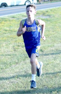 Holdenville sixth grader, Boston Bowman, sprints to the finish in his first place finish in the Holdenville xcountry meet. Bowman easily outdistanced all of his competition!