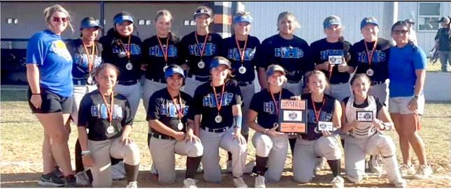 THE WOLVERINE SOFTBALL TEAM EARNED A RUNNER-UP TROPHY AT THE WILSON TOURNAMENT. Front row: Macy Gordon, Lexxi Goolsby, Alivia Griesinger, Darcy Shepherd, Hailey Cox, and Addie Brown. Second row: Coach Skipworth, Kmari Early, Anayiah Delarosa, Hayden Brummett, Mady Richmond, Dixie Gamble, Autumn Jackson, Bella Smith, Chloe Allison, Coach Angel Johnson.