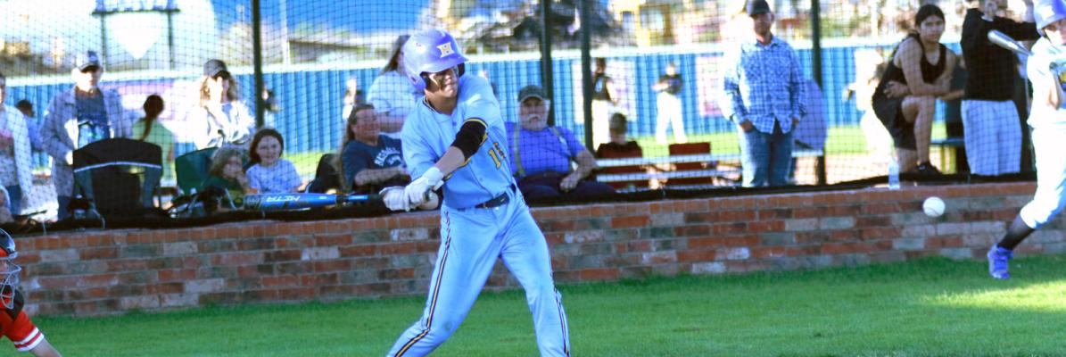Wolverine batter, Kaden Rogers, swings at a fastball in Holdenville’s game with McLoud. Holdenville will battle Keifer this Thursday for a trip to the regional tournament.