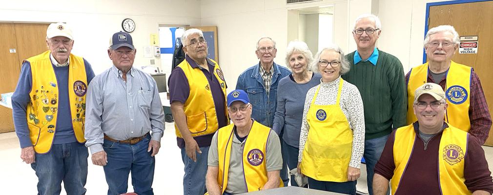 MEMBERS OF THE HOLDENVILLE LION’S CLUB HOSTED ANOTHER SUCCESSFUL POTATO BAR THIS YEAR. Local Lions pictured above at Friday night’s potato bar are (L-R): Larry Miller, Leon Barrett, Ernie Arocha, Steve Enos (seated), Bernice Steele, Jerri Lindsey, Robbie Lindsey, Trey Irby (seated), and Les Radach.