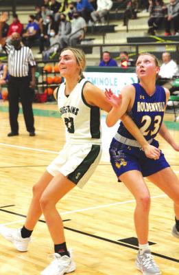 Holdenville’s basketball player # 23, Jessica Moore, blocks out a taller Chieftain player in the Wolverines contest at Seminole. Holdenville will participate this Thursday through Friday in the Latta Tournament.