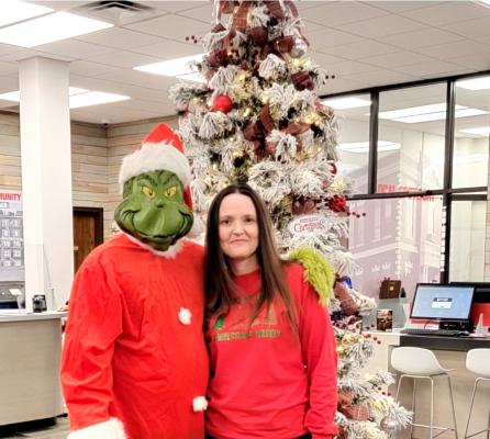 The Grinch stopped by for a bit of Christmas cheer from Ashley Mitchon at the First United Bank open house last week. His heart grew three times that day...