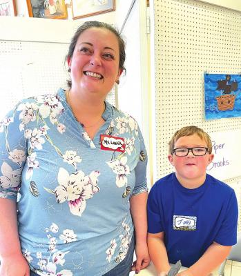 Instructor Laura Calvary pictured with on of her top art student Joby Smith.