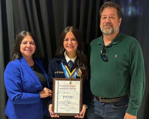 Senior Rylee Eckles received her State FFA Degree this year. She is pictured above with her parents Andrea and Robert.