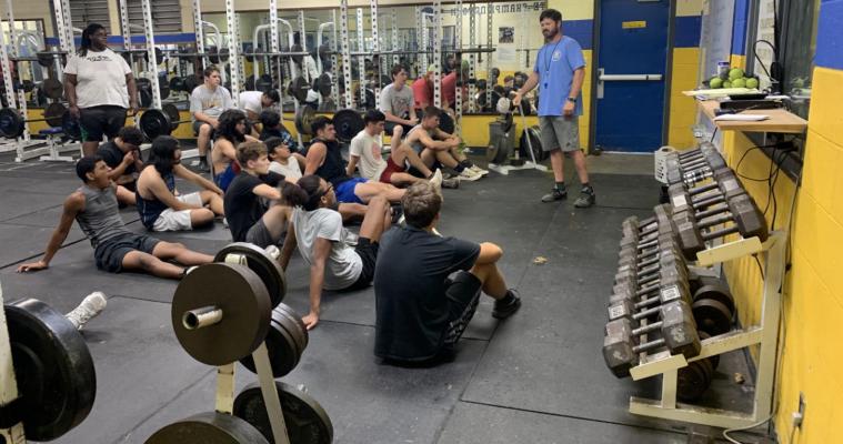 Holdenville Head Coach, David Barker, gives the Wolverines a early morning pep talk during the Summer Pride Program. The Wolverines are just a few weeks away from their first official practice.