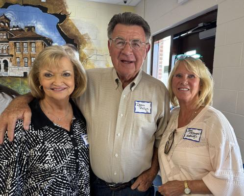DEBBIE PHILLIPS (LEFT) FROM THE CLASS OF 74 and her husband Dennis (Class of 1971) were happy to see Barb McDougal Aldridge at their recent high school reunion.