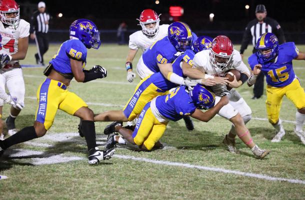 The Holdenville defense swarmed this Comanche running back. Wolverines defenders # 50, Joe Remis, # 60, Alyc Harjo, # 59,Tank Redmond, # 12 Jordan Harjo and # 15 Tenetke Lowe combined for the tackle.