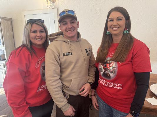 Aspen Wardlow and Kristie Lambert stop for a quick picture with K9 Officer Dylan Hale at the recent Shop with a Cop event.