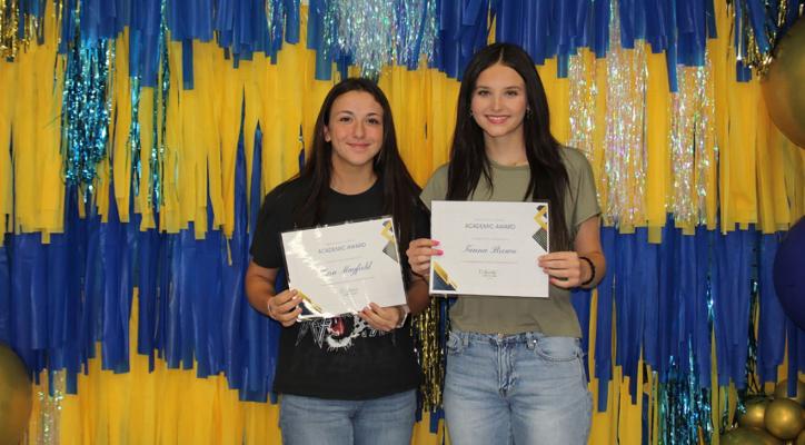 Kara Mayfield and Tanna Brown receive Academic Excellence awards in Freshmen English.