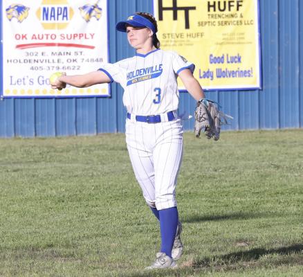 Cori Coates throws the ball back to the infield during Holdenville warm-ups prior to the Wolverines game with Wetumka.