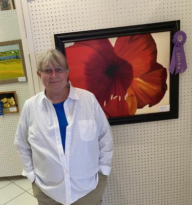 PEGGY DAVIS AWARDED BEST OF SHOW in the advanced category for her painting “Red Amaryllis”. Peggy was one of many talented artists to participate in this year’s Spring Art Show at HSPS. More Pictures Pages 8-9.