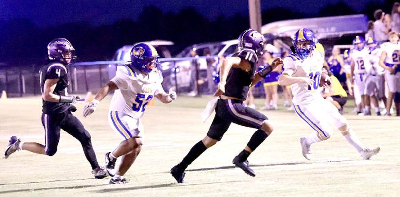 Holdenville lineman # 52, Aaron Toress, sprints to throw a block for Wolverine running back # 16, Camron Swayze in the Wolverines 62-0 win over Coalgate. Holdenville will host Tishomingo for Homecoming on Friday night.