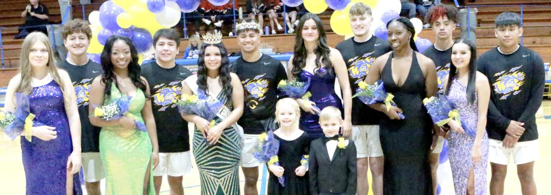 A NEW QUEEN WAS CROWNED AT HOLDENVILLE’S HOMECOMING. Pictured above are all Holdenville Basketball Homcoming candidates and their escorts. Pictured (L-R): Sophomore Chloe Allison, Wyatt Seeley, Senior Mylisha Allen, Canugee Tiger, Ryleigh Hill-Tiger, , Izaiah King, Senior Brooklyn Nelms, Gage Smith, Junior Dah-myah Olden, Kase Sipes, Freshman Chloie Tiger, and Jordan Harjo. Flower Girl, is Emersyn AnnMarie Lening, and Crown Bearer, Ransom Grant Weaver