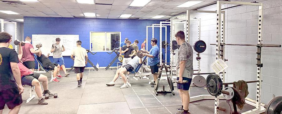 Summer Pride boys make good use of the weight facility which bears Coach Rawls’ name.