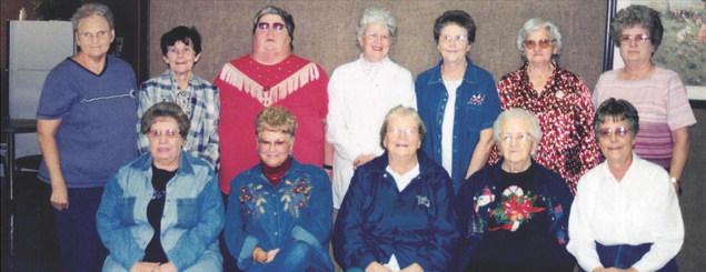 CHRISTMAS MEMORIES FROM LONG AGO...FORMER SEAMPRUFE EMPLOYEES GATHERED AT THEIR ANNUAL CHRISTMAS REUNION. Pictured are: (front) Julia House, Bonnie McCoy, Dovie Davis, Lois Goodwin, and Virgie Crawford. (back) Loretta York, Geraldine Bunch, Brenda Irons, Geneva Green, Joyce York, Evelyn Foster, and June Johnson. Not pictured but attending was Atha Simmons.