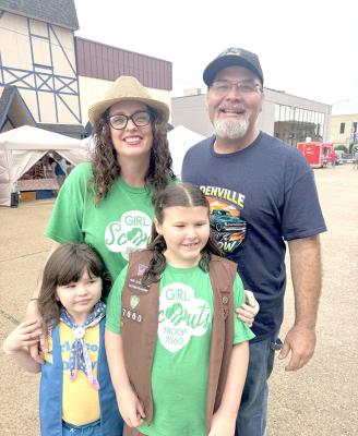 Members of Girl Scout Troup 7660 were impressed by many of the old cars this year. Pictured with mom and dad local business owners Cameron and Alicia Miller are Presley and August.