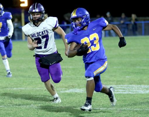Holdenville freshman running back # 23, Zavien Sullivan, sprints away from a Coalgate defender. The Wolverines will host Kingston Friday night.
