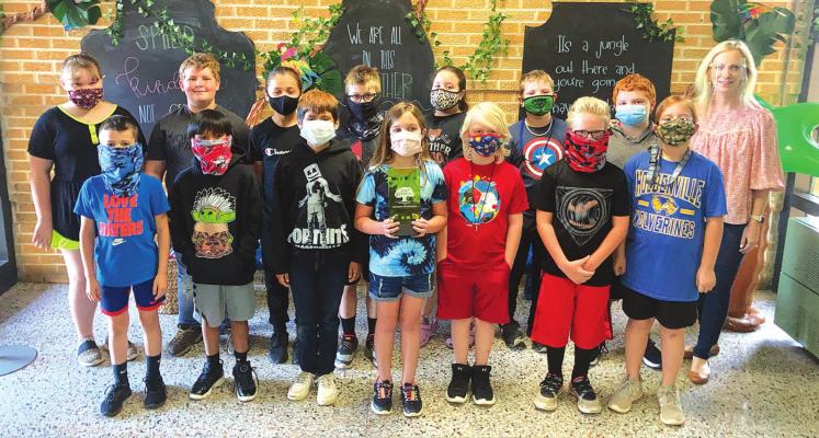 GE MODEL SCHOOL - A group of 3rd grade students at Reed Elementary join Principal Danielle Patterson in celebrating the school’s 18th consecutive year to be named a Great Expectations Model School.