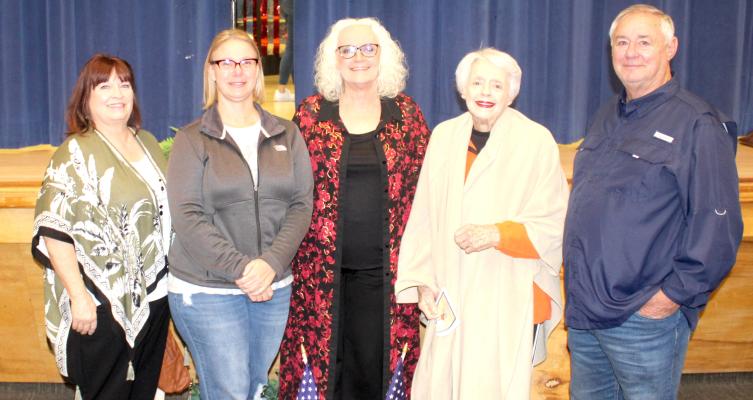 Reed Music Director Jana Pettis, pictured above with Darlene Williams, Jana’s daughter Melissa Jung, Jana’s mother Arjean Williams, and Neal Williams, always makes the Veterans Day program at Reed Elementary one to remember.