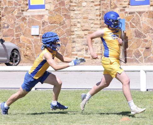 The chase is on....Two Wolverines had a bit of a game of chase going on in one of the football team’s Spring drills.