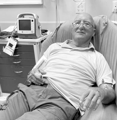 Roy Boydstun in a bed in the Seminole emergency room Sunday after he was bitten on the arm by a Pygmy Rattlesnake. Pictured at right is Boydstun’s arm, which was marked by doctors to show where the swelling was located. Boydstun has coined a new phrase to help others to avoid becoming a snakebite victim: “Look before you pull.” —Courtesy Photos